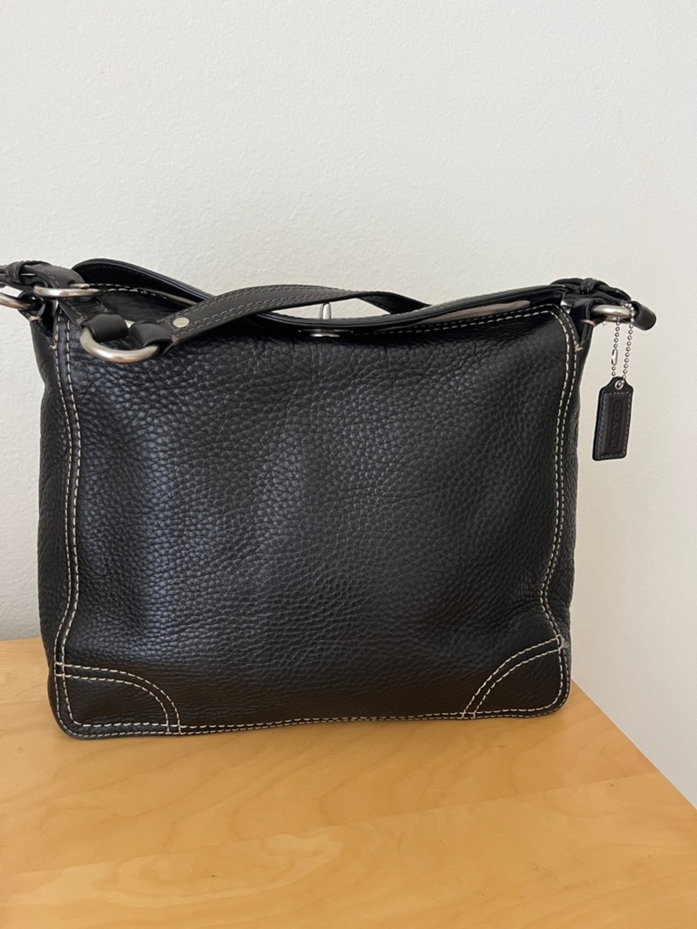 Vintage Coach Black Pebbled Leather Hobo Shoulder Bag with Contrast Stitching.